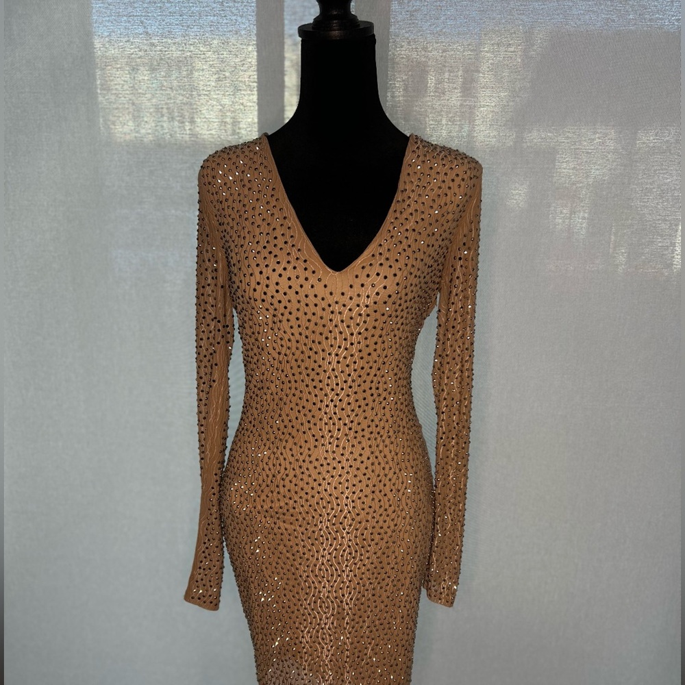 Turn heads in this stunning, rhinestone-studded dress!